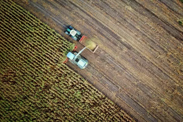 A tractor on a field. Photo: Unsplash.